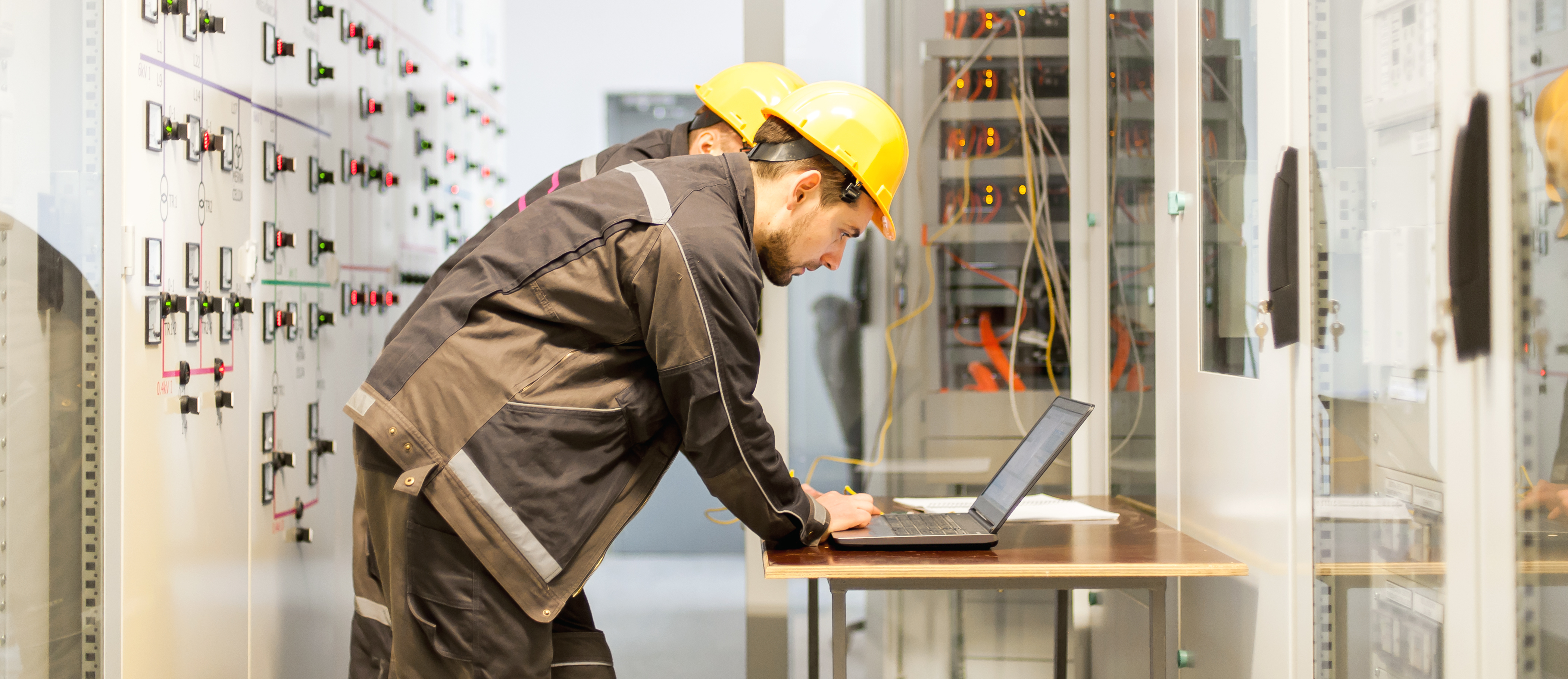 Two,Maintenance,Engineers,Inspect,Relay,Protection,System,With,Laptop,Computer.